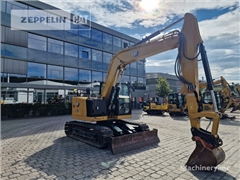 Minikoparka Caterpillar 310